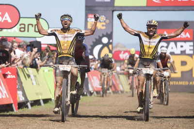 Manuel Fumic and Henrique Avancini of Cannondale Factory Racing crossing the finish line during the 2018 ABSA Cape Epic