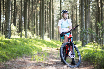 Beani Thies posing for the camera on her Specialized Enduro Bike
