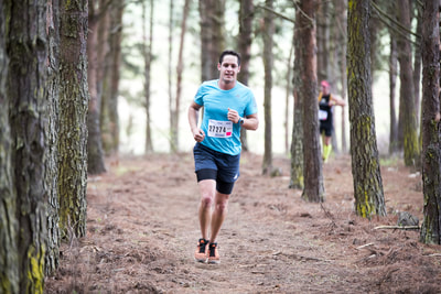 Nicholas Riddin all smiles as he edges closer to the finish of his trail run - (c) Andrew Mc Fadden / BOOGS Photography