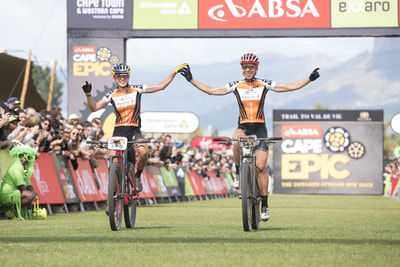 Eventual ladies overall winners, Annika Langvad and Kate Courtney ofInvestec Songo Specialized, crossing the final finish line of the 2018 ABSA Cape Epic